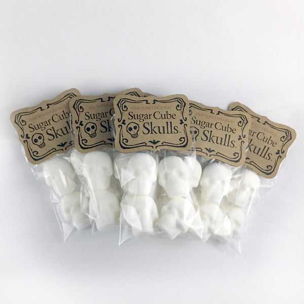 5 Bags of Skull Sugar Cubes, fanned out on white background, Kraft Labels say Dem Bones Original Sugar Cube Skull