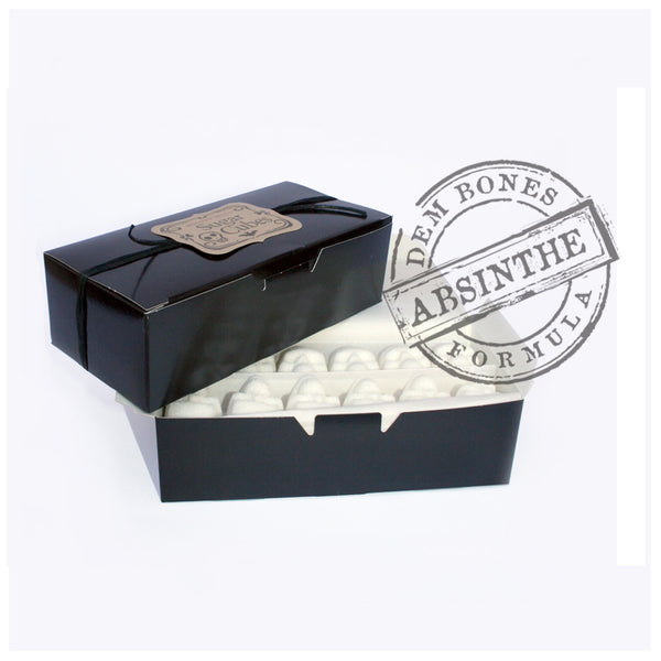Stacked black boxes of Sugar Cube Skulls, DemBones Absinthe Formula Rubber stamp, white background
