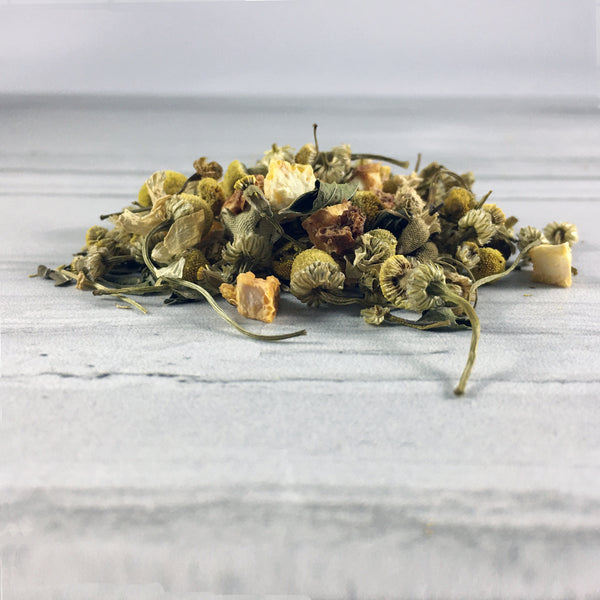 Close up of DemBones sleepy hallow herbal tea on white marble background close up of tea