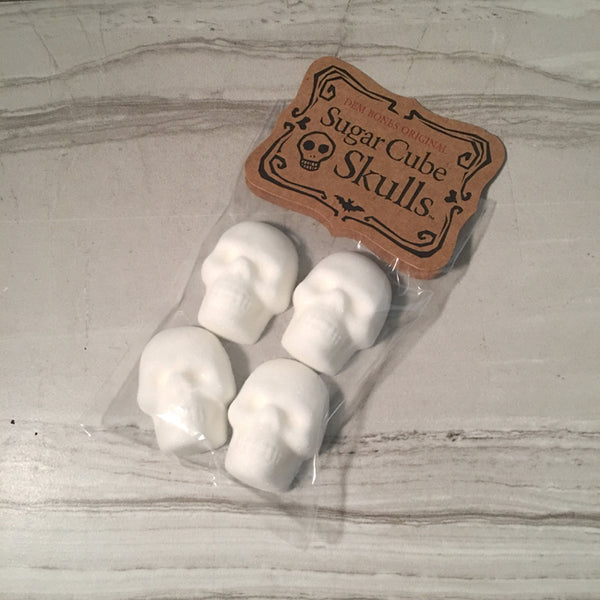 Sugar Cube Skull in Bag on Grey Tile Background